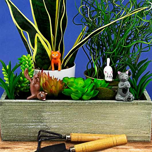 figurine chat yoga pot plante